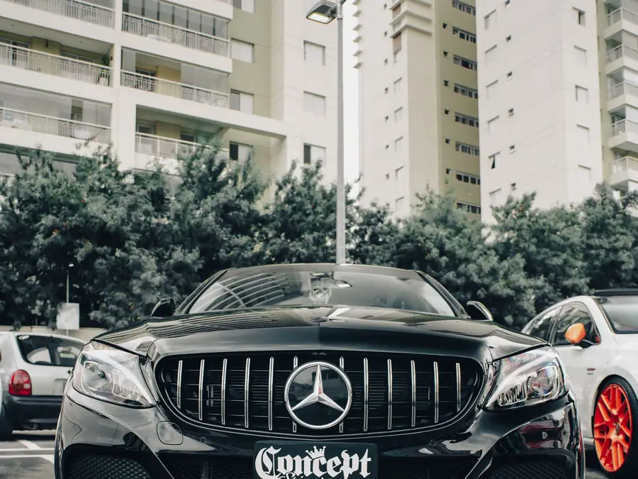 Black Mercedes-Benz S 450 L saloon photographed head-on in the city